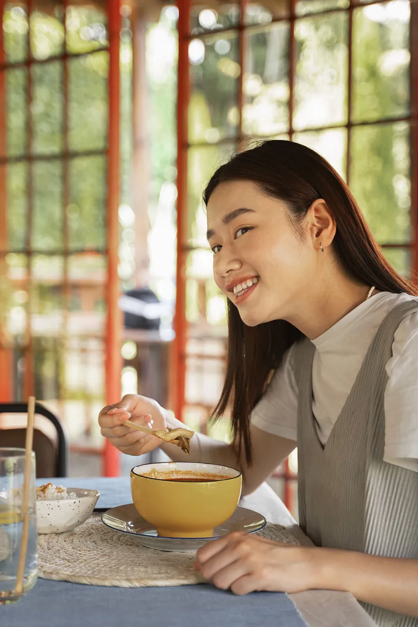A customer eating at a restaurant table.